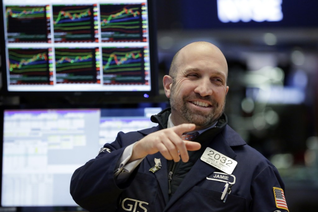 Specialist James Denaro works on the floor of the New York Stock Exchange on Monday.