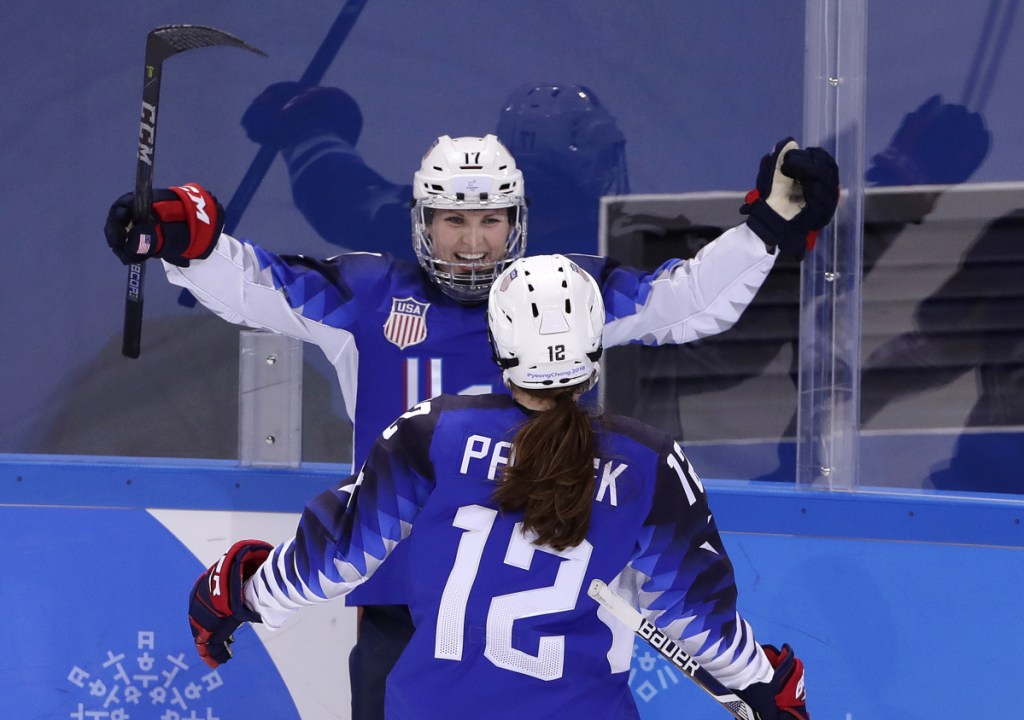Jocelyne Lamoureux-Davidson (17), of the United States, celebrates her second goal against the team from Russia with Kelly Pannek (12) during the second period.