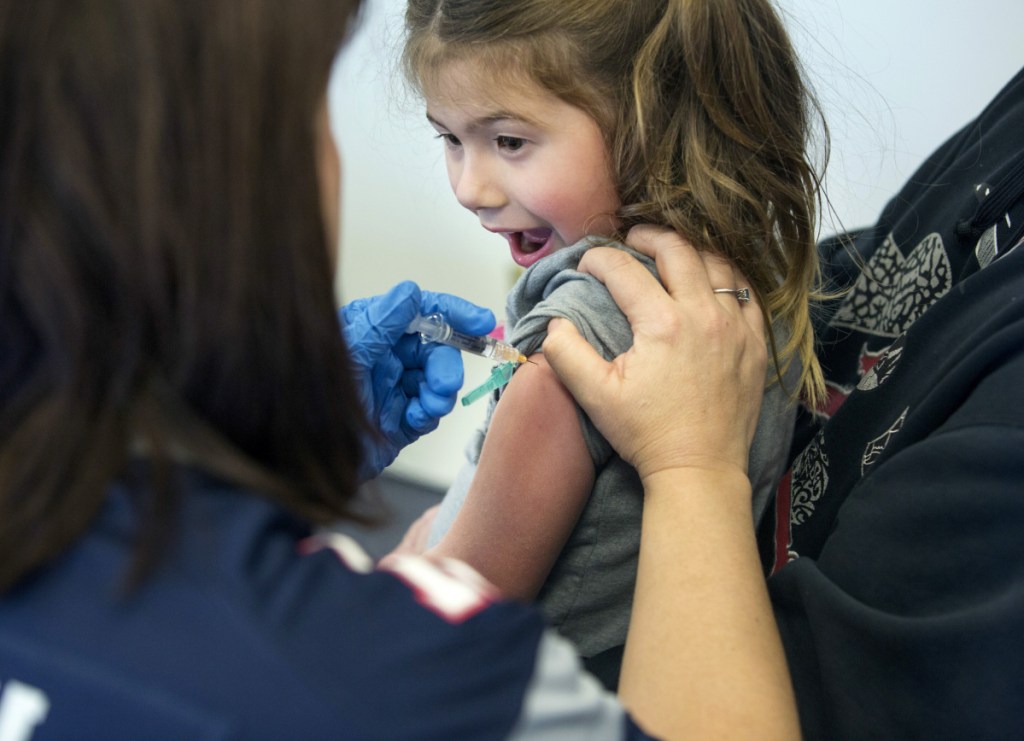 Angel Van Deventer, 5, of South Portland reacts as she gets a flu shot at a clinic hosted Feb. 2 by VNA Home Health Hospice. 