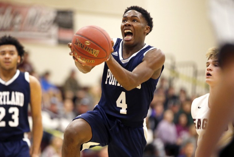 Portland's Terion Moss goes for a layup after a breakaway against Windham in December 2017.