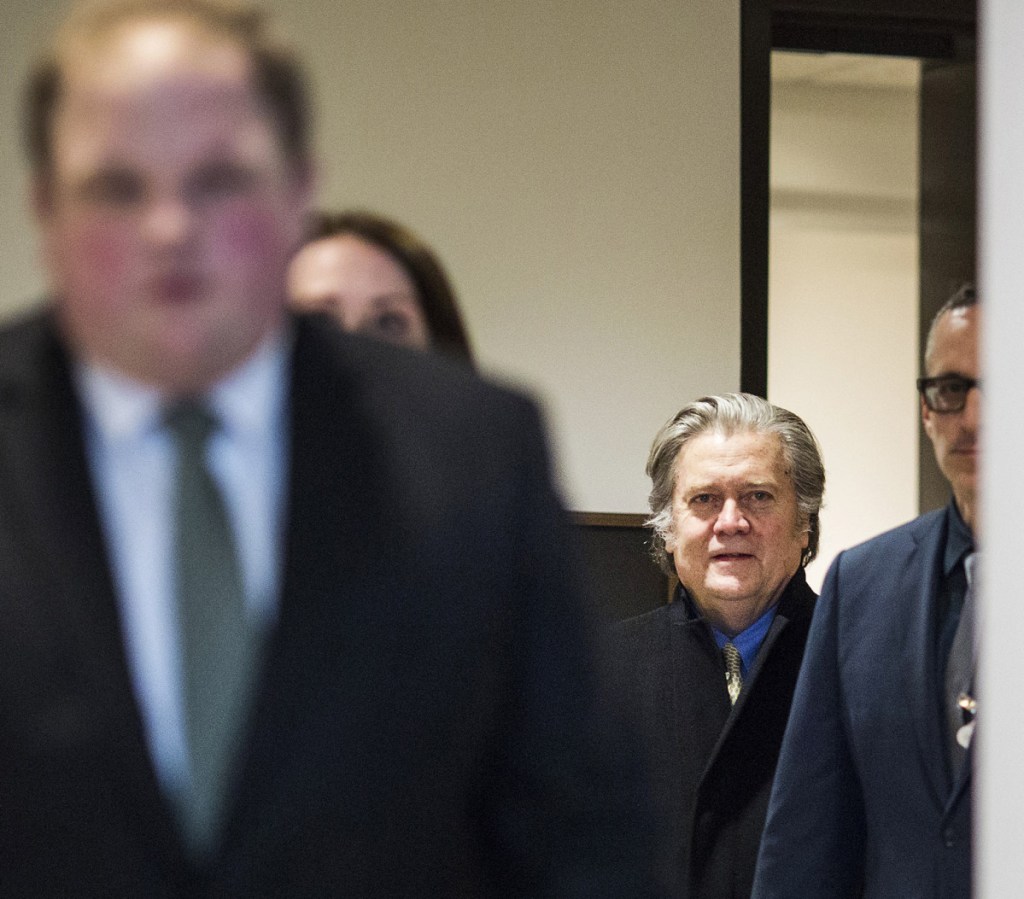 Steve Bannon, former top White House strategist, center, arrives to testify before the House Intelligence Committee in Washington, D.C., on Thursday. Lawmakers warn that he might be held in contempt of Congress if he's uncooperative.