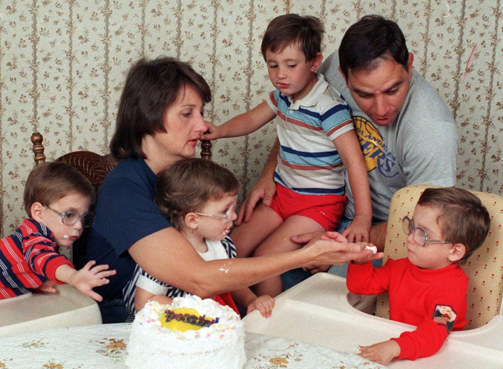 The three surviving Frustaci septuplets, Stephen, Patricia, and Richard, from left, join parents Patti and Sam Frustaci and older brother Joseph, 4, in 1988.