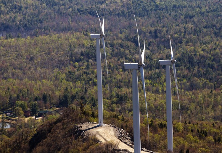 Wind turbines in Dixfield atop a ridge south of Webb Lake. Gov. LePage's moratorium order is being challenged.