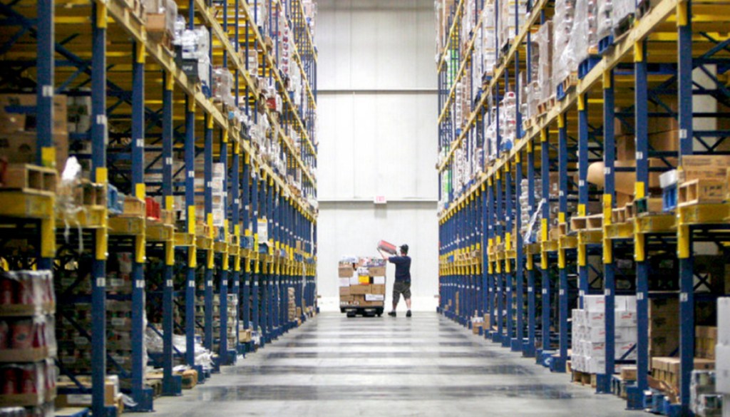 A Hannaford worker loads products in one of the aisles of the South Portland distribution center in 2014. 