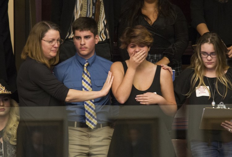 Sheryl Acquarola, 16, a junior from Marjory Stoneman Douglas High School, is overcome with emotion in the gallery of the Florida House of Representatives after the lawmakers Tuesday voted not to hear an assault rifle measure.
