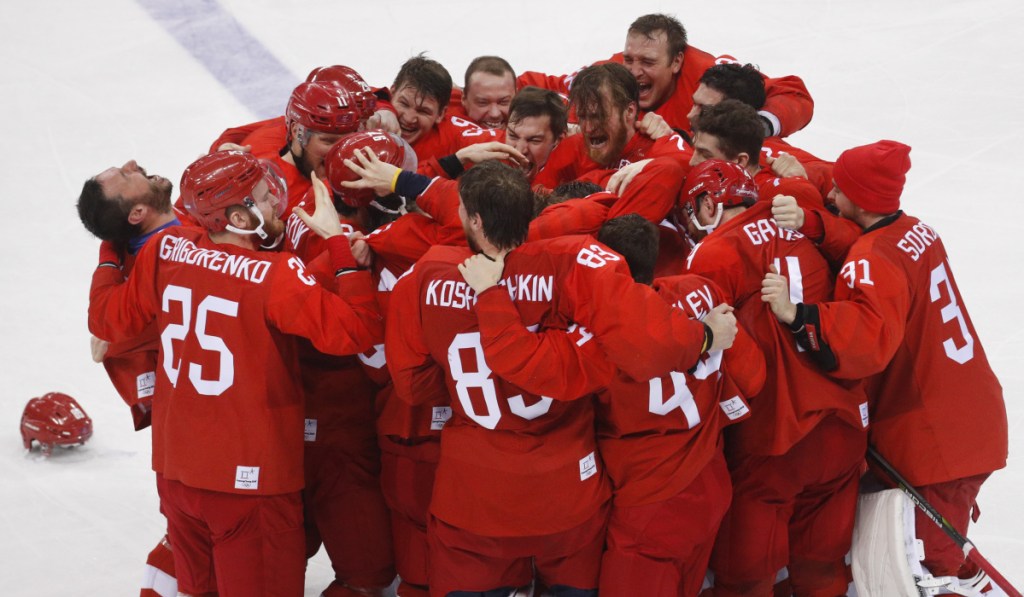 With the gold medal on the line, the Russian hockey team came through Sunday, coming from behind late in regulation, then scoring in overtime to defeat Germany 4-3 in the men's gold-medal game.