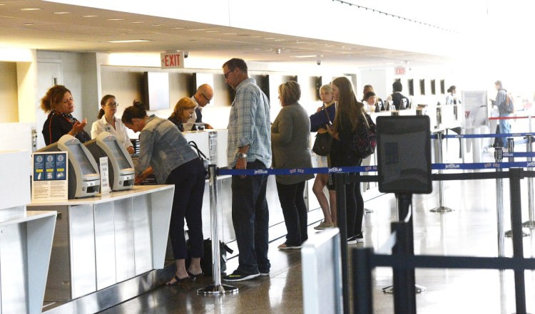 Passengers get tickets and check their luggage at the Portland International Jetport. More passengers used the airport in 2018 than in any year before.