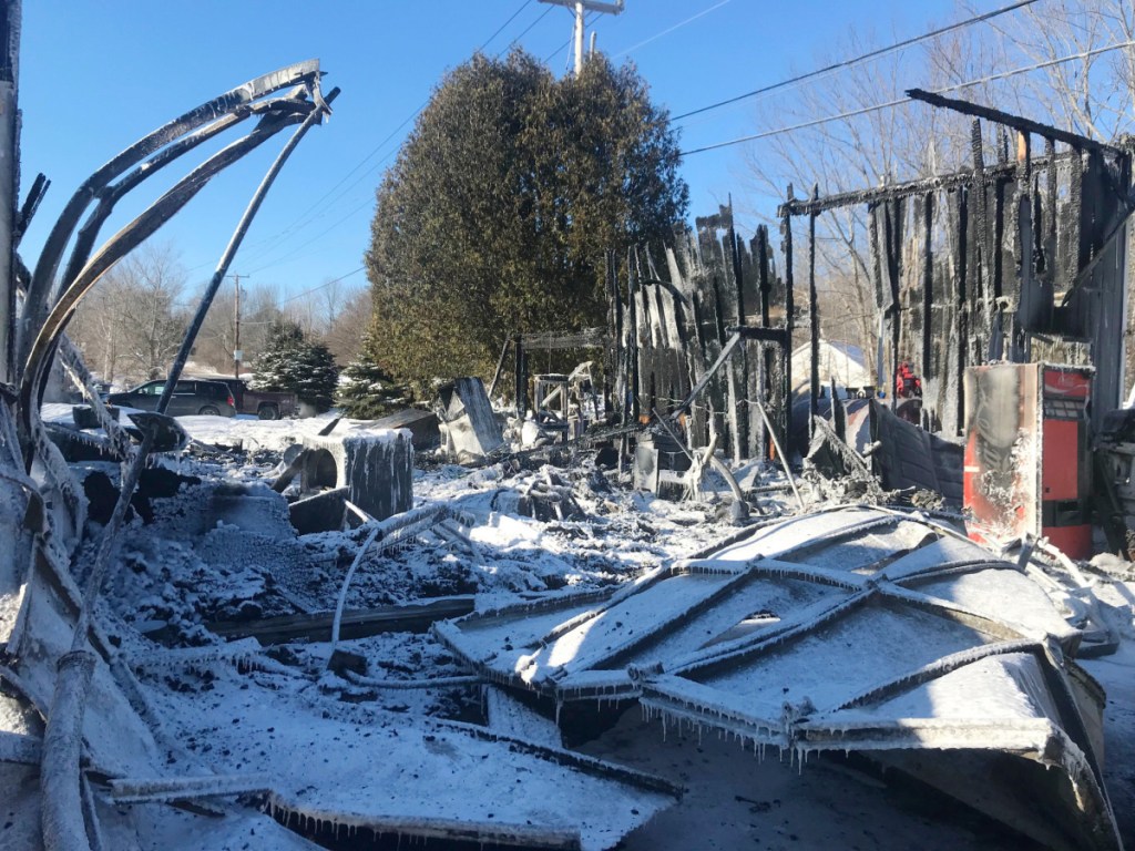 Charred studs show the outline of the Belgrade Boat Shop, which was destroyed by fire early Saturday in Belgrade.