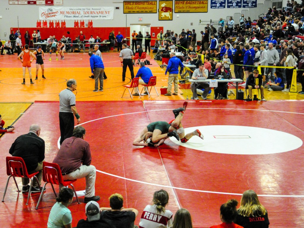 Oxford Hills' Dylan Cobbett, top, and Cony's Jakob Arbour wrestle in the 152-pound consolation semifinals match at the Kennebec Valley Athletic Conference championships Saturday at Cony High School in Augusta.