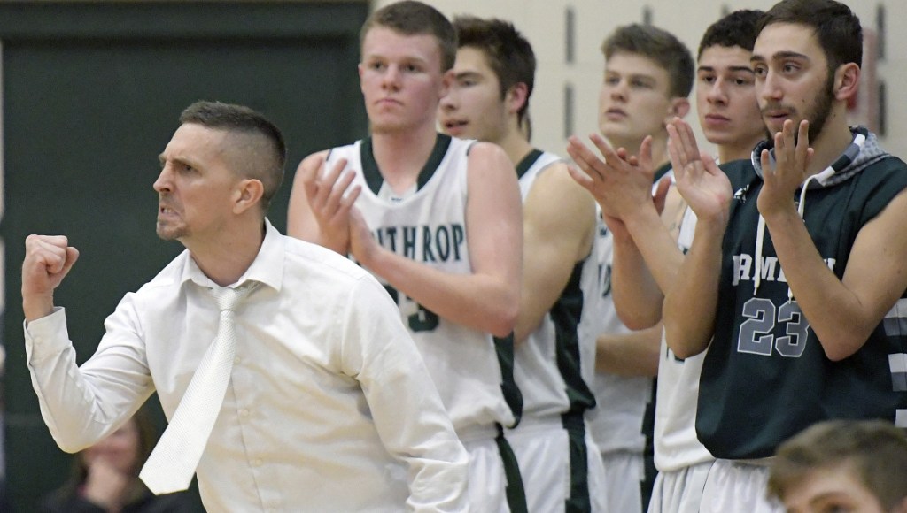 Winthrop coach Todd MacArthur and his team react to a basket during a during a Mountain Valley Conference game against Spruce Mountain on Monday night in Winthrop.