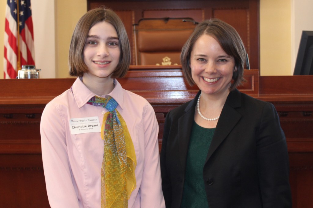 Charlotte Bryant, left, served as an honorary page in the Maine Senate. She was the guest of Sen. Shenna Bellows.