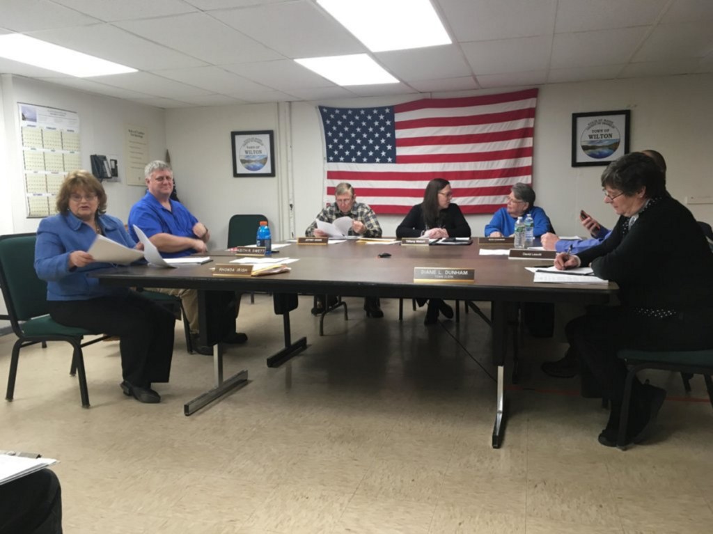 Town Manager Rhonda Irish, left, meets with Selectpersons Keith Swett, Jeffrey Adams, Tiffany Maiuri, Ruth Cushman, David Leavitt and Town Clerk Diane Dunham on Tuesday night at the Wilton Town Office. The board discussed marijuana regulations with a member of the Planning Board.