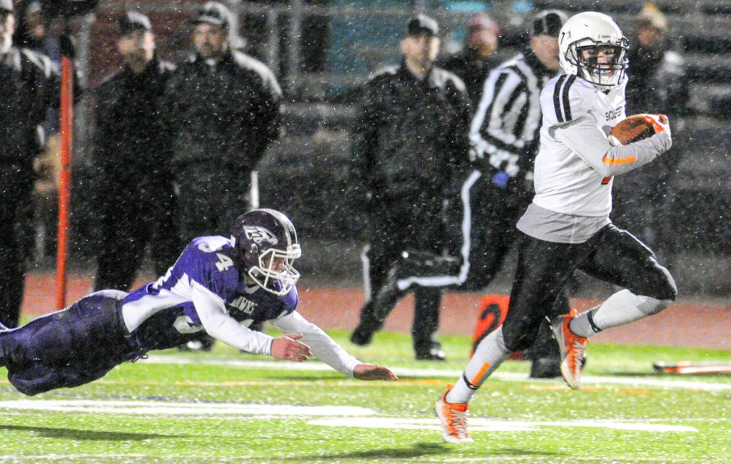 Skowhegan senior Jon Bell out-runs Marshwood defender Colby Leach during a 99-yard kickoff return for a touchdown in the Class B state title game last fall at Fitzpatrick Stadium in Portland.