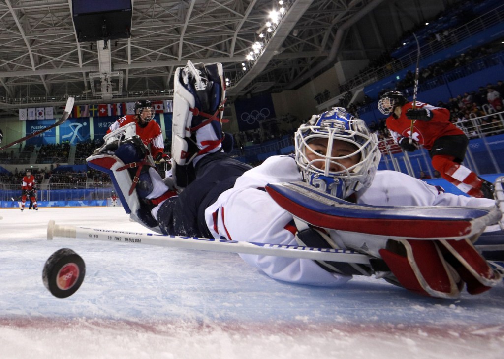 South Korea's goalie Shin So-jung, of the combined Koreas team, watches the puck go into the goal shot off a shot by Phoebe Staenz, of Switzerland, during the second period of a preliminary round game at the 2018 Winter Olympics in Gangneung, South Korea on Saturday.