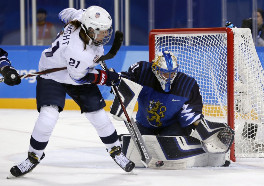 Noora Raty (41), of Finland, blocks a shot by Hilary Knight (21), of the United States, during the second period of the preliminary round of the women's hockey tournament Sunday at the 2018 Winter Olympics in Gangneung, South Korea.