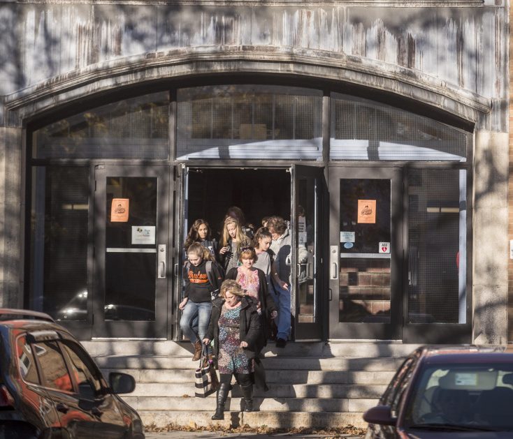 Students emerge from Winslow Junior High School at the end of the school day in Winslow on Nov. 8, 2017. The building committee is presenting a revised plan for closing the junior high and moving seventh- and eighth-grade students to the high school and sixth-graders to the elementary school.