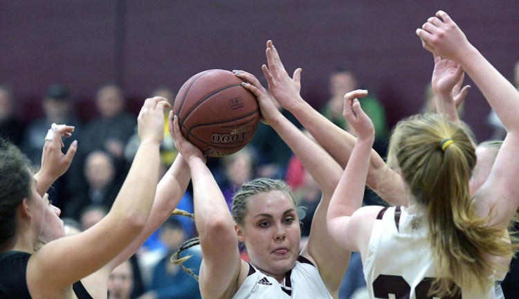 RICHMOND, ME - JANUARY 13: Richmond High School's Sydney Underhill-Tilton goes up for two through Waynfleet's defense during a basketball game on Tuesday February 13, 2018 in Richmond.(Staff photo by Andy Molloy/Staff Photographer)