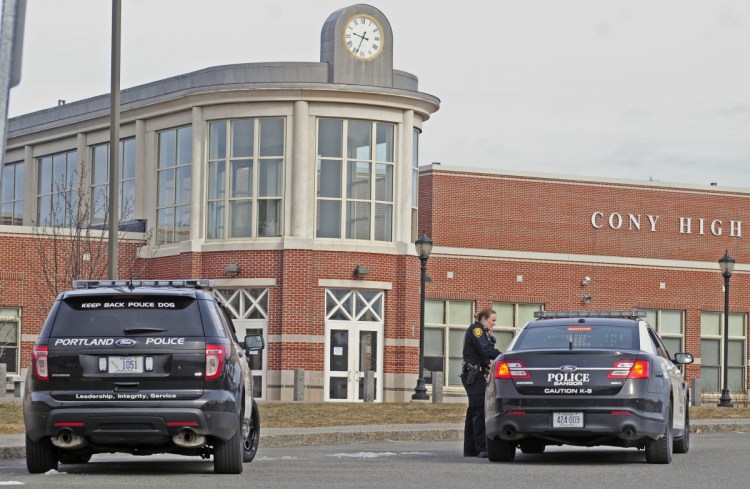 Police are seen during a search of Cony High-Middle School in Augusta on March 4, 2016, following a reported bomb threat there. In an unrelated incident, Augusta police this week charged Cony Middle School student with terrorizing after he allegedly made a threat involving a firearm.