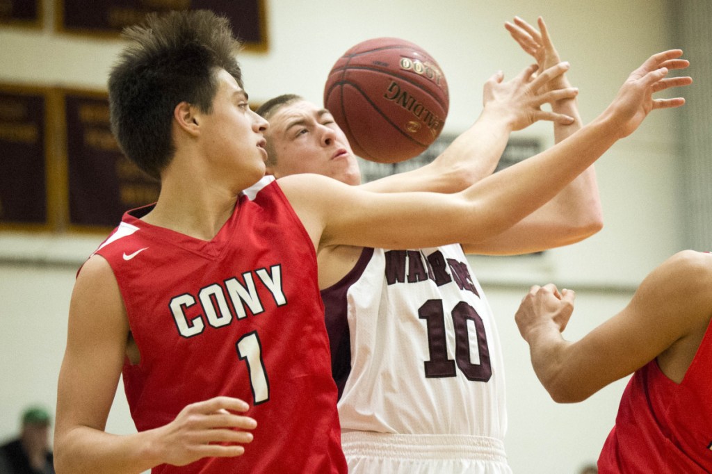 Nokomis' Brock Graves (10) battles for a rebound with Cony's Ian Bowers (1) during a Class A North game earlier this season in Newport.