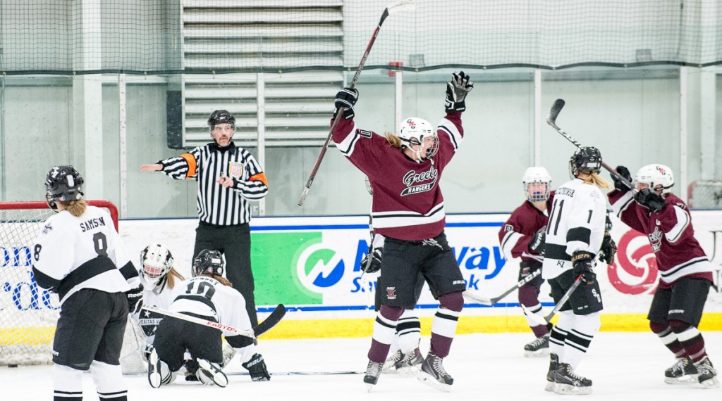 Greely's Courtney Sullivan, center, celebrates a goal during a playoff game at the Norway Savings Bank Arena in Auburn.