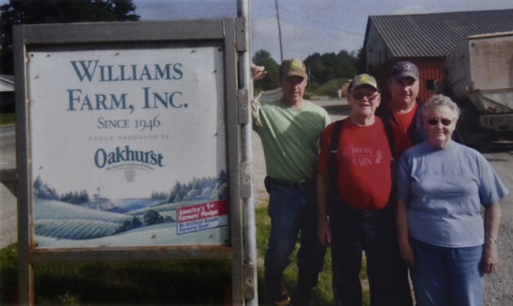 The Williams Farm in North Anson is being recognized by the town of Anson in the annual report for this year's Town meeting. Standing in the rear are current owners Richard Williams, left, and brother Andy. Their parents, Harvey and Jean Williams, are in the foreground.