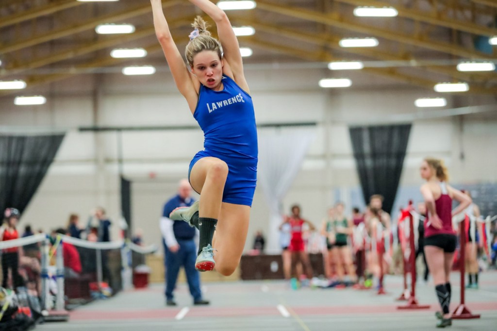 Lawrence's Payton Goodwin competes in the long jump during the Class B indoor track state championships Saturday at Bates College.