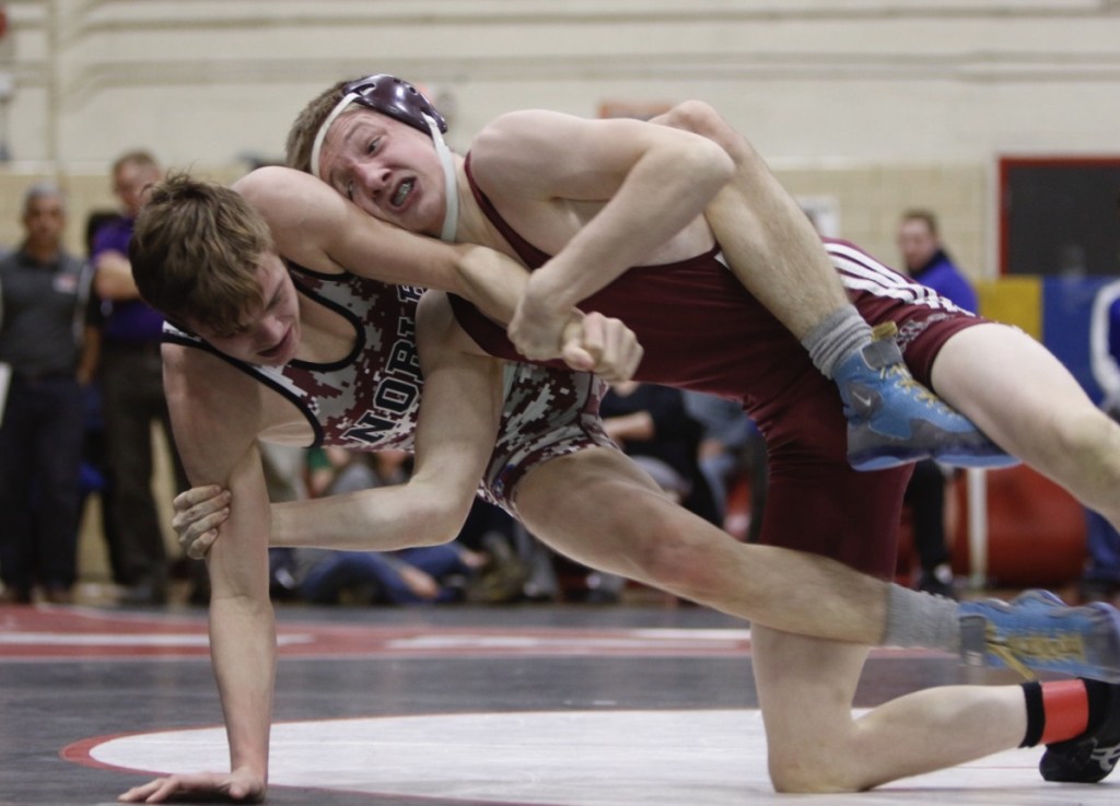 Nokomis' Joshua Brown and Noble's Joshua Cote wrestle in the 120-pound finals at the Class A wrestling championships Saturday in Sanford.