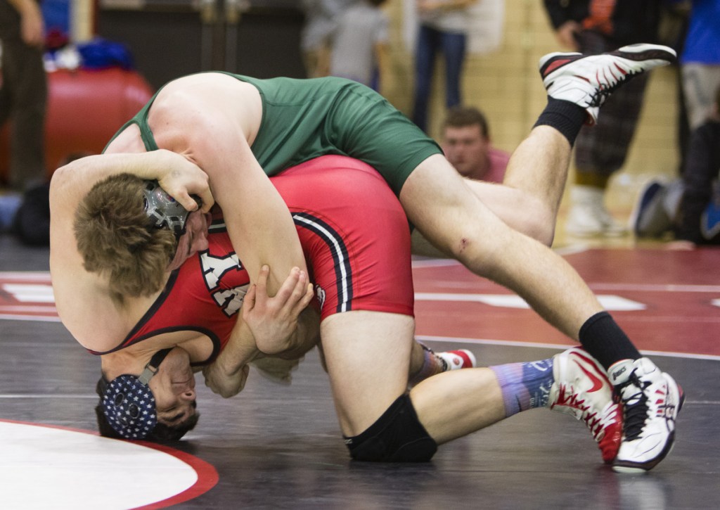 Portland Press Herald photo by Carl D. Walsh
Oxford Hills' Jeff Worster rolls over Cony's Nic Mills in a 195-pound bout at the Class A wrestling championships Saturday in Sanford.