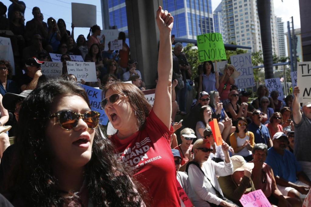 Helena Moreno, center, yells during a protest against guns on the steps of the Broward County Federal courthouse in Fort Lauderdale, Fla., on Feb 17. Nikolas Cruz, a former student, is charged with killing 17 people at Marjory Stoneman Douglas High School in Parkland, Fla., on Wednesday.