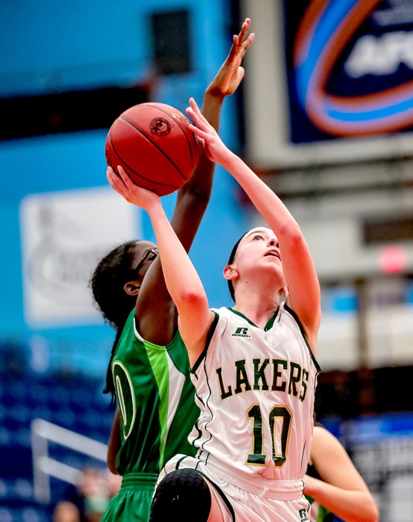 Rangeley's Brooke Egan eyes the basket as Pine Tree Academy's Regence Sandy defends during a Class D South quarterfinal game Monday at the Augusta Civic Center.