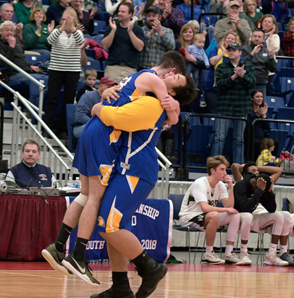 Boothbay players celebrate after they stunned Waynflete 65-64 in a Class C South quarterfinal game Monday at the Augusta Civic Center.