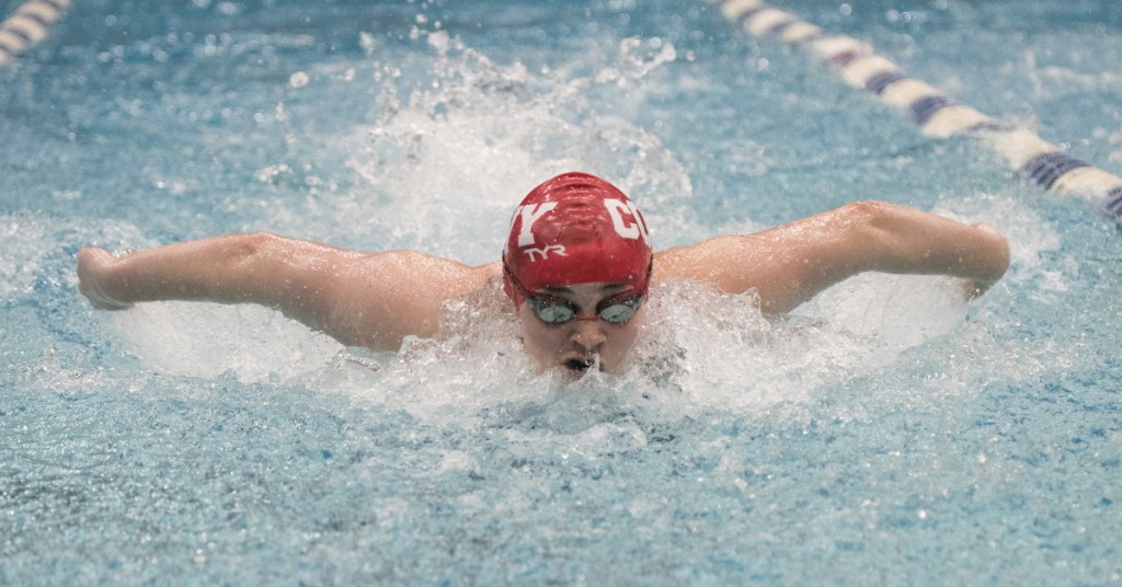 Cony's Gabby Low competes in the 100-yard butterfly during the Class A state championship meet Monday in Orono. Low won with a time of 55.38.