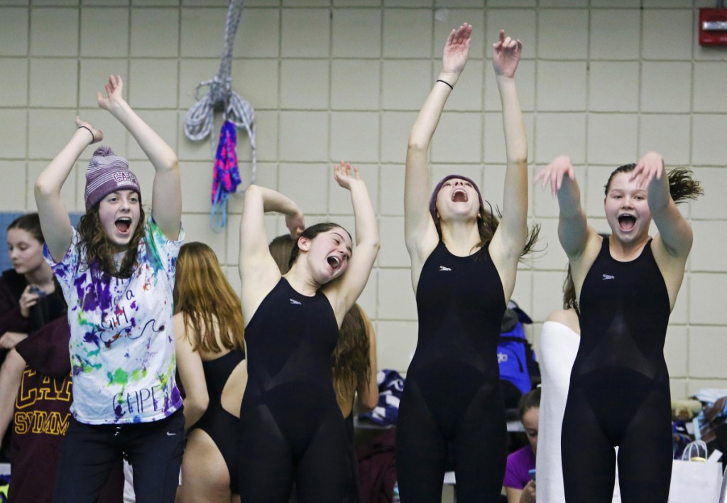 Cape Elizabeth teammates Olivia Tighe, Maddie McCormick, Corinne Wight and Hope Campbell get excited early in the Class B State swimming and diving championships Monday at Bowdoin College.