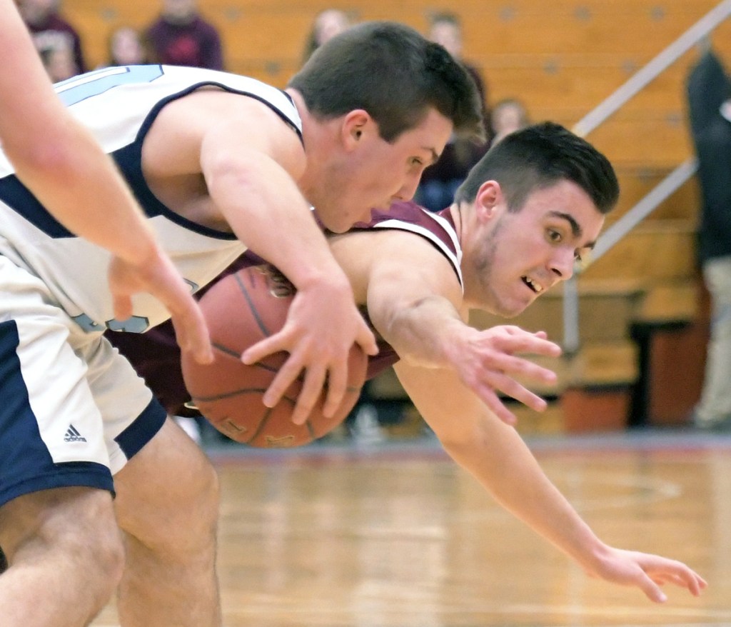 Richmond's Zach Small tries to grab possession of the ball from Dirigo's Alex Gorham during a Class C South quarterfinal game Monday night at the Augusta Civic Center.