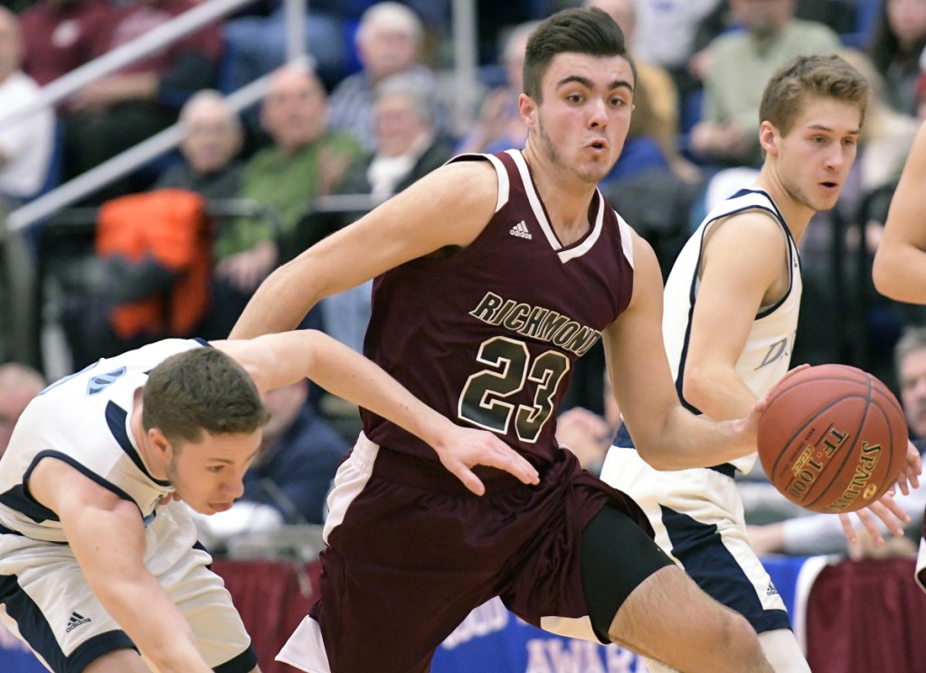 Richmond guard Zach Small dribbles past Dirigo defender Jacob Goudin during a Class C South quarterfinal game Monday night at the Augusta Civic Center.