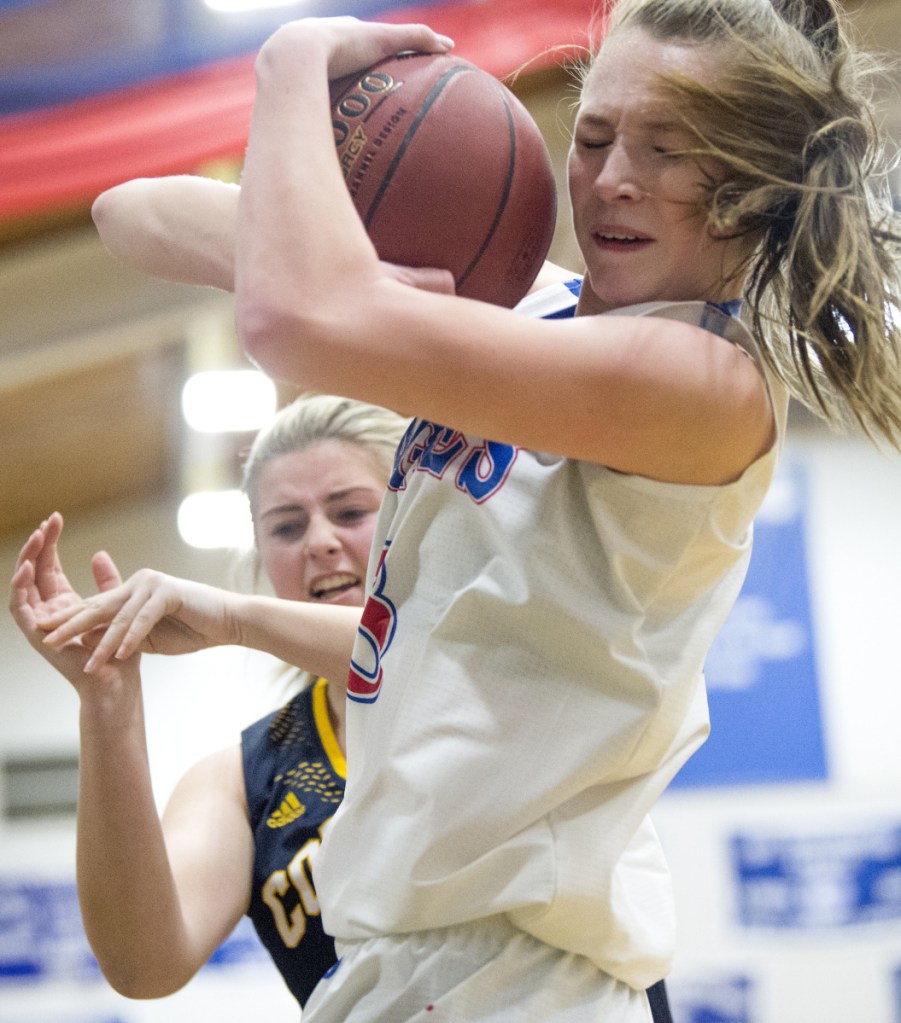 Messalonskee sophomore Gabrielle Wener grabs a rebound over Mt. Blue's Aislynn Provencher during a Kennebec Valley Athletic Conference Class A game earlier this season in Oakland.