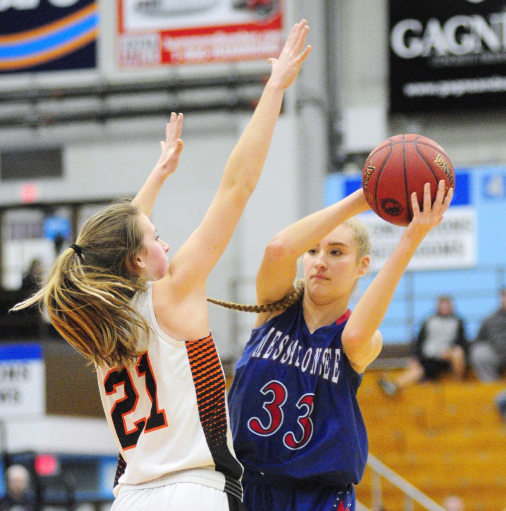 Skowhegan junior forward Annie Cook defends Messalonskee senior guard/forward Alyssa Turner during a Class A North semifinal game Wednesday at the Augusta Civic Center.