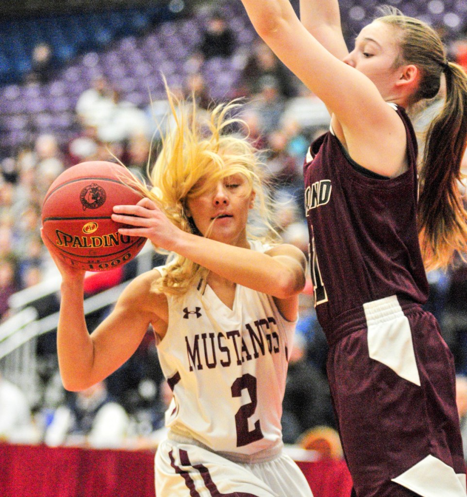 Monmouth's Audrey Fletcher, left, faces pressure from Richmond's Ashley Abbott during a Class C South semifinal game Thursday at the Augusta Civic Center.