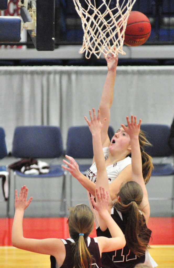 Monmouth senior Abbey Allen goes up for a rebound during a Class C South semifinal game against Richmond on Thursday at the Augusta Civic Center.