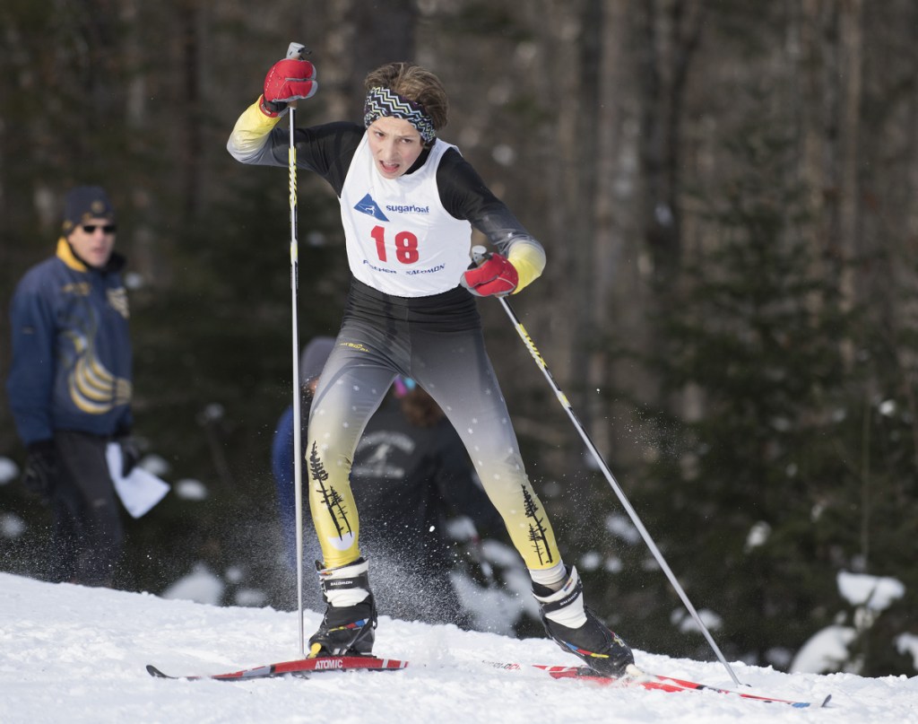Maranacook's Carter McPhedran climbs a hill halfway through the first Nordic race of the season at the Sugarloaf Outdoor Center in mid-December.