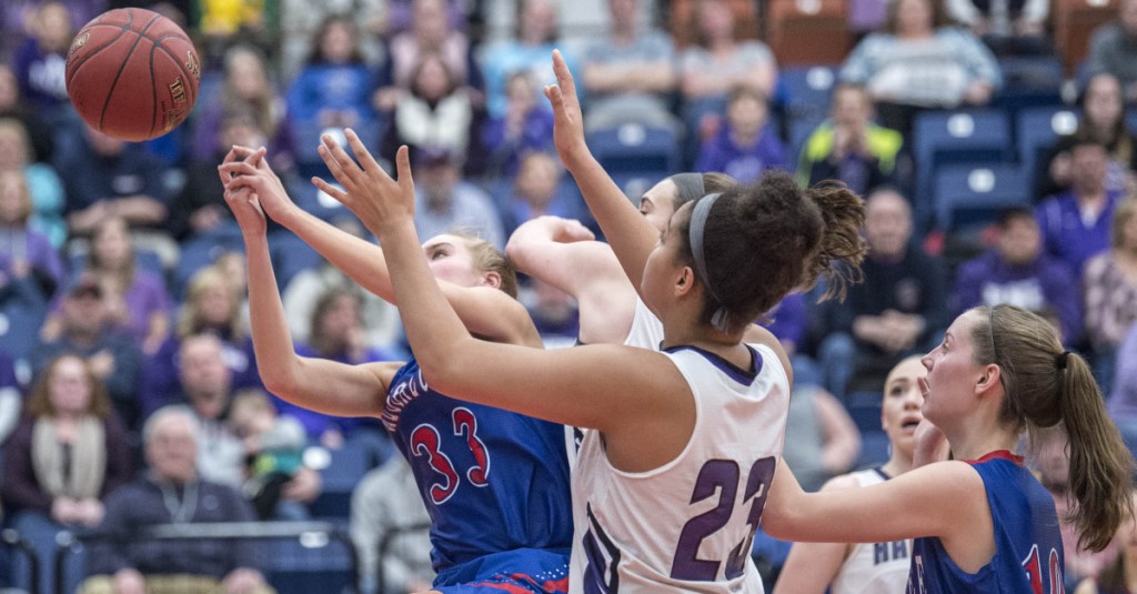 Messalonskee senior Ally Turner battles for a rebound with Hampden's Bailey Donovan during the Class A North title game Friday night at the Augusta Civic Center.