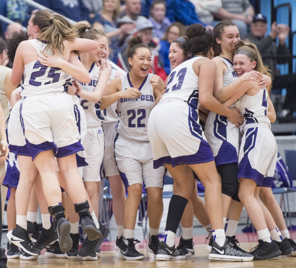 Hampden Academy celebrates its win over Messalonskee in the Class A North championship game Friday night at the Augusta Civic Center.