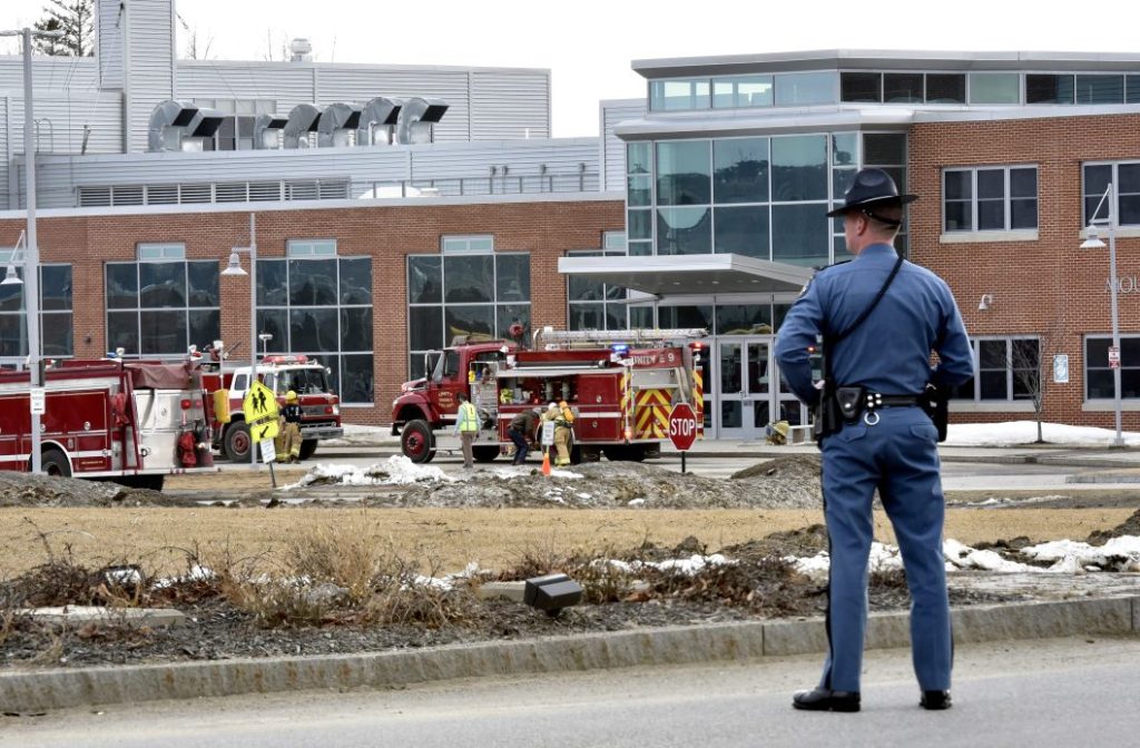A state trooper blocks the entrance to the Mount View school complex in Thorndike as firefighters respond to a report of a chemical release Wednesday. About 750 students, along with the school staff, evacuated the buildings. Apparently a student released pepper spray in a classroom, affecting about 20 students.