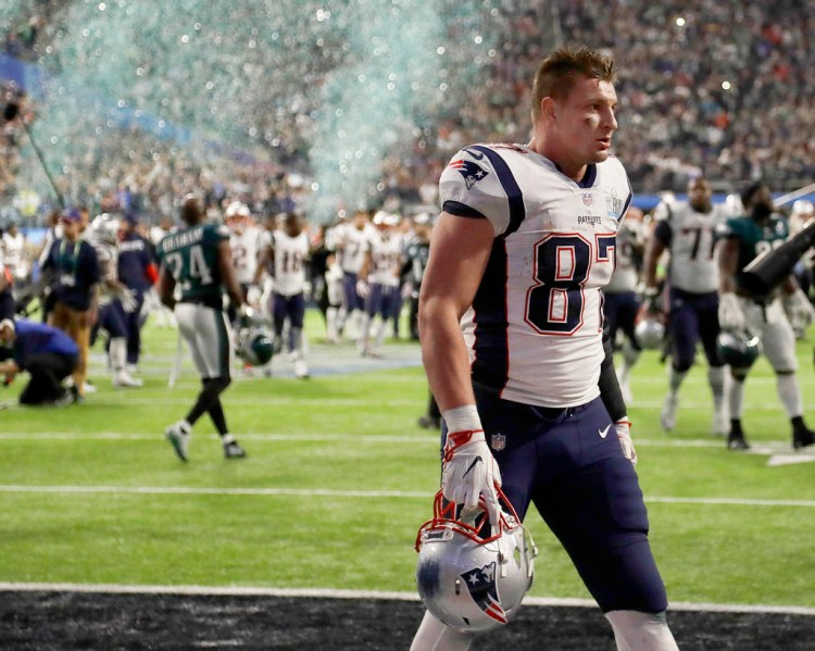 Rob Gronkowski walks off the field after the Patriots' loss to the Eagles in Super Bowl 52 Sunday night. The Eagles won 41-33. 