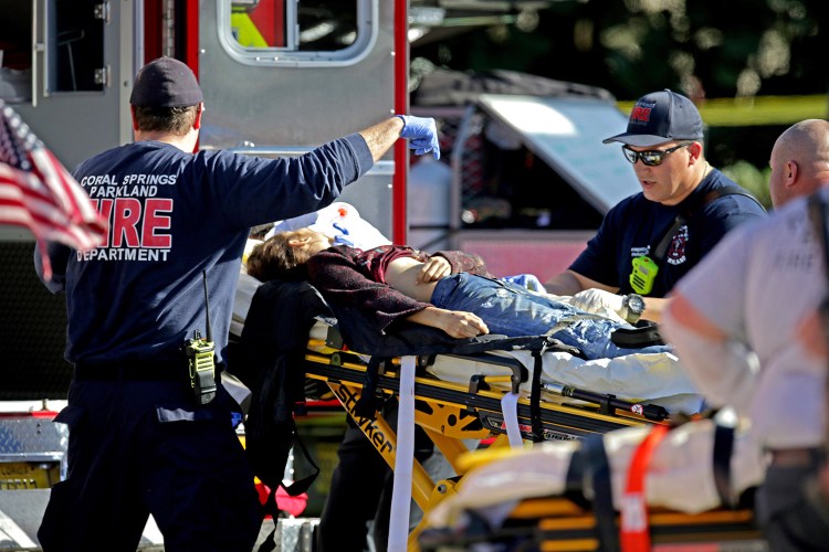 Medical personnel tend to a victim after Wednesday's shooting. Police evacuated the students and staff from the building.