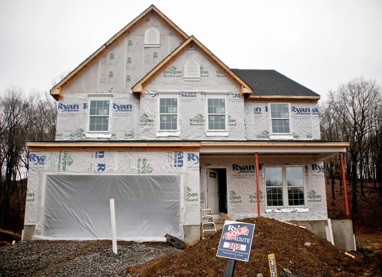 Construction is under way at a new housing project in Zelienople, Pa., this month.  Sales of new U.S. homes fell in January for the second straight month.