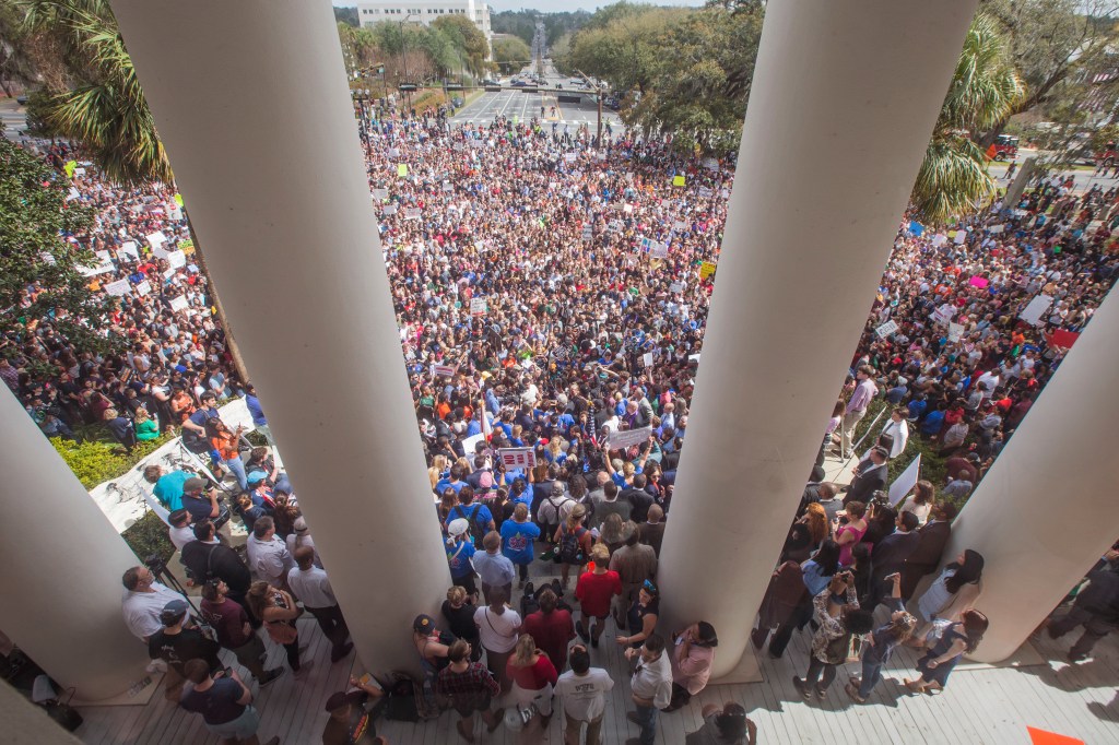 Protesters rally against gun violence on the steps of the old Florida Capitol in Tallahassee, Fla., Feb 21, 2018. Students at schools across Broward and Miami-Dade counties in South Florida planned short walkouts that day, the one week anniversary of the deadly shooting at Marjory Stoneman Douglas High School. 