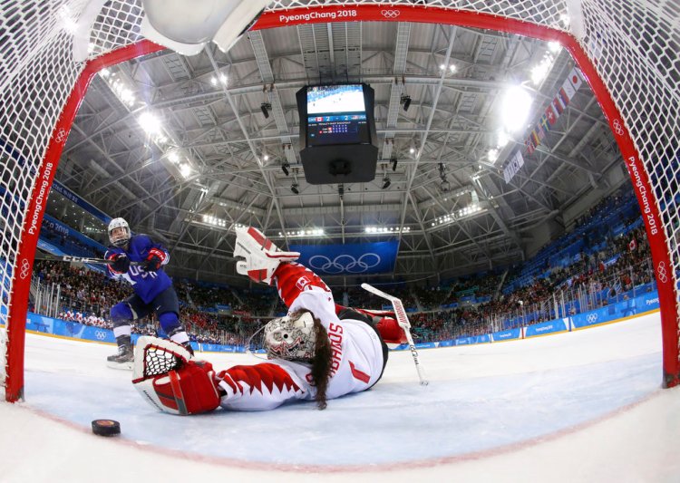 Jocelyne Lamoureux-Davidson of the United States scores the game- winning goal against  Shannon Szabados  of Canada in the overtime shootout Thursday. 