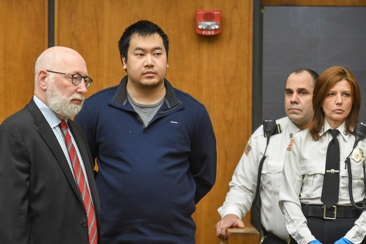 Jeffrey Yao appears with his lawyer, J.W. Carney Jr., in Woburn District Court on Feb. 26 in Woburn, Mass. Yao pleaded not guilty to murder and other charges in connection with the killing of a University of New England medical student at the Winchester Public Library. 