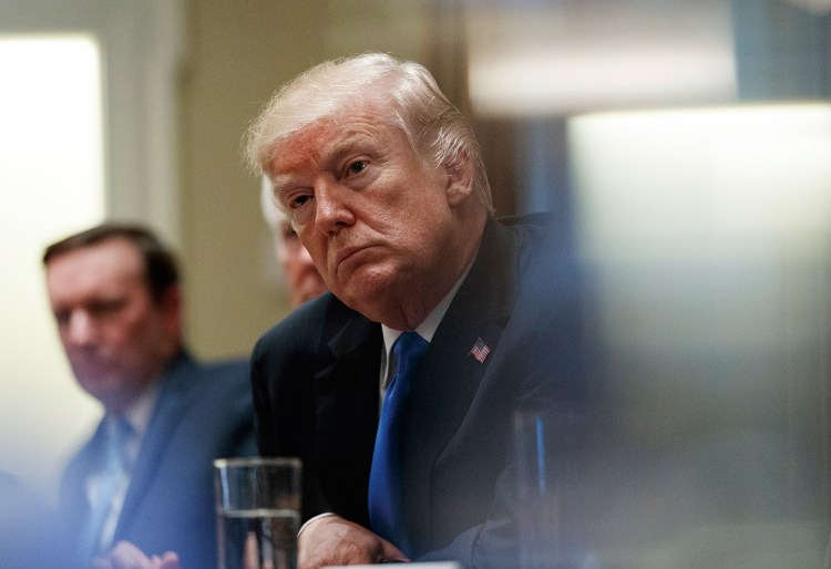 President Trump pauses during Wednesday's meeting at the White House to discuss school and community safety with members of Congress.